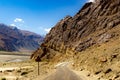 Curved hilly highway in between barren himalayan mountains of leh ladakh, jammu and kashmir, India Royalty Free Stock Photo