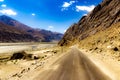 Curved hilly highway in between barren himalayan mountains of leh ladakh, jammu and kashmir, India Royalty Free Stock Photo