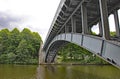 Curved metal bridge spans the River Elbe in Germany