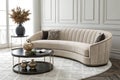 Curved modern sofa with vases on coffee table Royalty Free Stock Photo