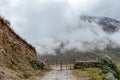 Curved mountain road in misty mountains, Abra Mariano Llamoja, pass between Yanama and Totora, The Choquequirao trek, Peru