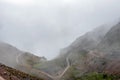 Curved mountain road in misty mountains, Abra Mariano Llamoja, pass between Yanama and Totora, The Choquequirao trek, Peru