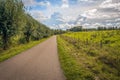 Curved narrow country road in a Dutch landscape Royalty Free Stock Photo