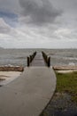 Curved Path to Pier Stormy Afternoon - Vertical Royalty Free Stock Photo