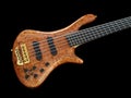 Curved patterned wood bass guitar on black Royalty Free Stock Photo