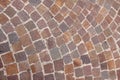 Curved pavement of colorful red granite blocks Royalty Free Stock Photo