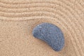 Curved pebble on raked sand