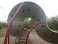 Curved playground climbing structure wall with hand and foot holds