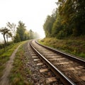 Curving railroad tracks through misty landscape showcasing speed blur Royalty Free Stock Photo