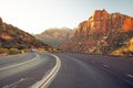 Curved red rock asphalt road running through Zion National Park Royalty Free Stock Photo