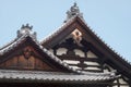 The curved roofs of Kuri topped with Morikuni. Kinkaku-ji temple. Kyoto. Japan