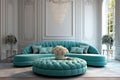 Curved round turquoise tufted sofa and pouf in room with white classic panels wall