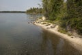 Curved, sandy shoreline of Jenny Lake, Jackson Hole, Wyoming.