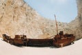 Curved ship on Zakynthos island, Greece Navagio beach, or shipwreck beach,sometimes called smugglers ` Bay , on the coast of