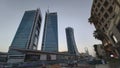 Curved skyscraper and Kingdom Tower inthe far perspective view in Riyadh at twilight