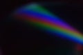 A curved spectrum of refracted light glows Royalty Free Stock Photo