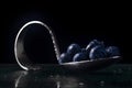 Curved spoon with blueberries