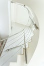 Curved stairs in beige interior