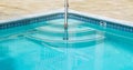 Curved steps into a swimming pool Royalty Free Stock Photo