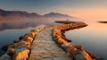 Curved Stone Pathway Leading into Serene Lake at Sunset. Royalty Free Stock Photo