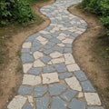 Curved stone pathway set in a garden with irregularly shaped gray a Royalty Free Stock Photo