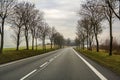 Curved Two Lane Country Road Winding Through Trees. Royalty Free Stock Photo