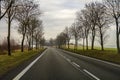 Curved Two Lane Country Road Winding Through Trees. Royalty Free Stock Photo