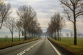 Curved Two Lane Country Road Winding Through Trees. Royalty Free Stock Photo