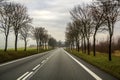 Curved Two Lane Country Road Winding Through Trees. Royalty Free Stock Photo