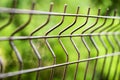 Curved welded steel fence closeup