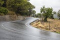 Curved wet asphalt road in a rain Royalty Free Stock Photo