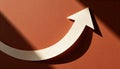 Curved white arrow pointing upward on a textured orange background with dramatic shadows Royalty Free Stock Photo