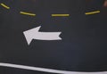 Curved White Traffic Arrow Symbol on the Road
