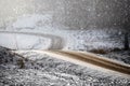 Curved and windy frosty dirt road