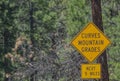 Curves and Mountain Grades Sign in the Arizona Pine Forest. Flagstaff Arizona