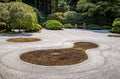 Curves, shapes and designs drawn into sand of a typical Japanese garden Royalty Free Stock Photo