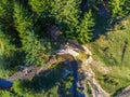 Curving ,clean ,small riverbed near pine forest aerial drone  shot at summertime Royalty Free Stock Photo