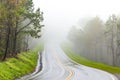 Curving Mountain Road In Fog With Copy Space