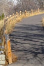 Curving mountain road with wooden fence in Utah