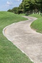 Curving pathway green golf course and beautiful nature scene. Royalty Free Stock Photo