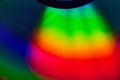 Curving rainbow colored light on dark background asset
