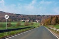 Curving road between fields and trees in Germany LanggÃÂ¶ns in Spring Royalty Free Stock Photo