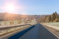 Curving road between fields and trees in Germany LanggÃÂ¶ns in Winter Royalty Free Stock Photo