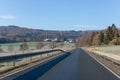 Curving road between fields and trees in Germany LanggÃÂ¶ns in Winter Royalty Free Stock Photo