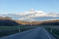 Curving road between fields and trees in Germany LanggÃÂ¶ns in Winter Royalty Free Stock Photo