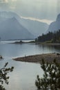 Curving shoreline of Jackson Lake, sun rays, Jackson Hole, Wyomi Royalty Free Stock Photo