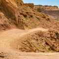 Curving trail on a rugged cliff in Moab Utah Royalty Free Stock Photo