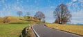 Curvy country road in hilly bavarian landscape Royalty Free Stock Photo