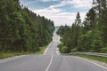 Curvy mountain road serpentine in green summer forest Royalty Free Stock Photo