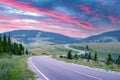 Curvy mountain road serpentine in summer mountains Royalty Free Stock Photo